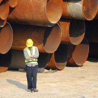 a municipal engineer with iron sewer pipes